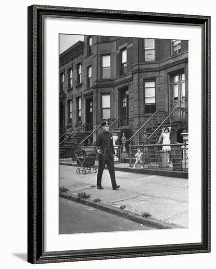 Children Watching a Policeman Walk His Beat in Front of Apartment Buildings-Ed Clark-Framed Photographic Print