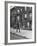 Children Watching a Policeman Walk His Beat in Front of Apartment Buildings-Ed Clark-Framed Photographic Print
