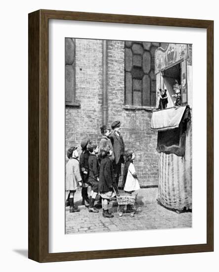 Children Watching a Punch and Judy Show in a London Street, 1936-Donald Mcleish-Framed Giclee Print