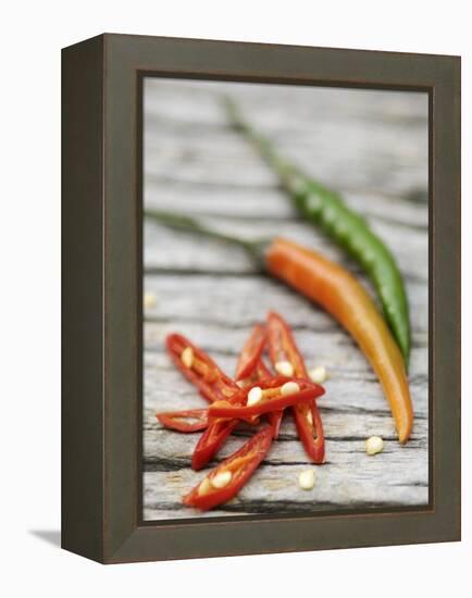 Chili Peppers, Whole and Sliced-Winfried Heinze-Framed Premier Image Canvas