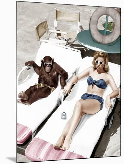 Chimpanzee and a Woman Sunbathing-null-Mounted Photo