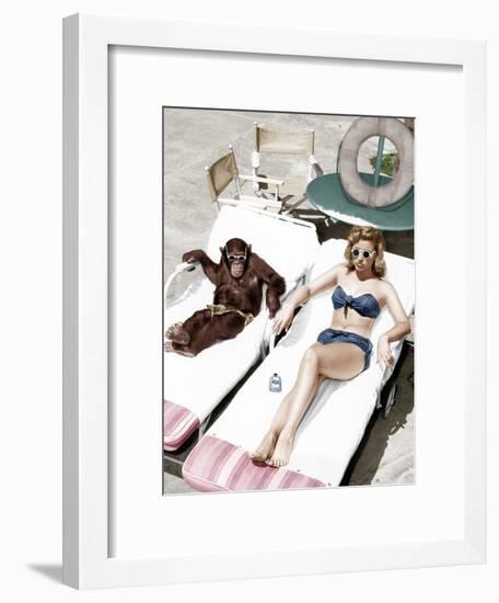 Chimpanzee and a Woman Sunbathing-null-Framed Photo