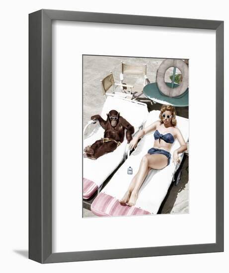 Chimpanzee and a Woman Sunbathing-null-Framed Photo