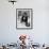 Chimpanzee Dining at a Table-null-Framed Photographic Print displayed on a wall