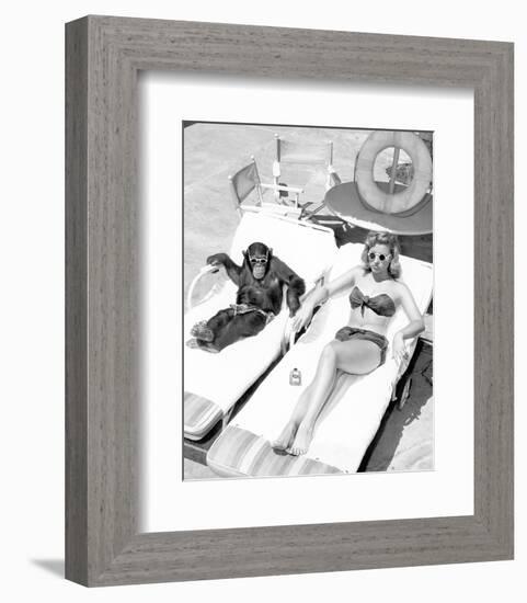 Chimpanzee & Woman Sunbathing-null-Framed Art Print