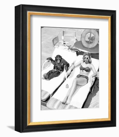 Chimpanzee & Woman Sunbathing-null-Framed Art Print