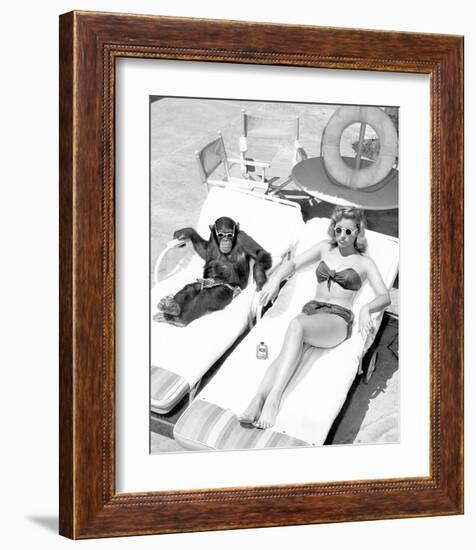 Chimpanzee & Woman Sunbathing-null-Framed Art Print