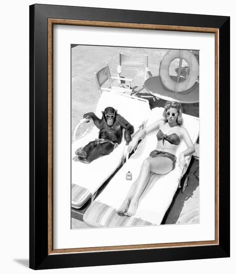 Chimpanzee & Woman Sunbathing-null-Framed Art Print