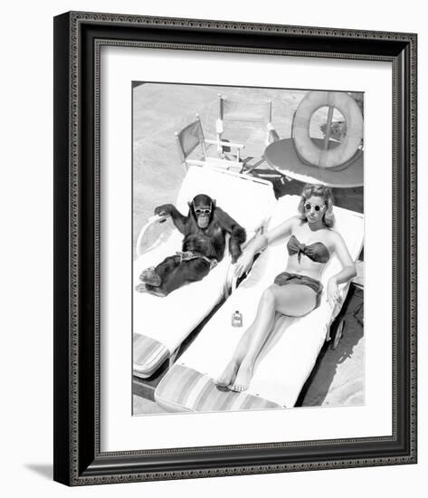 Chimpanzee & Woman Sunbathing-null-Framed Art Print