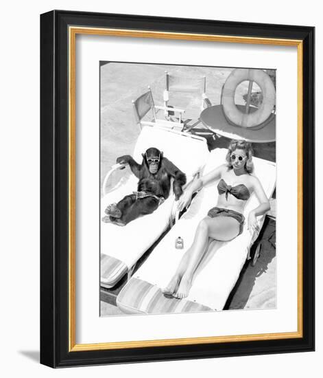 Chimpanzee & Woman Sunbathing-null-Framed Art Print