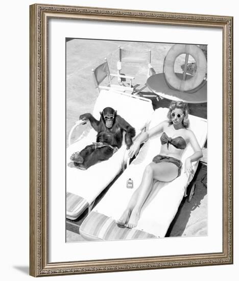 Chimpanzee & Woman Sunbathing-null-Framed Art Print