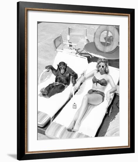 Chimpanzee & Woman Sunbathing-null-Framed Art Print