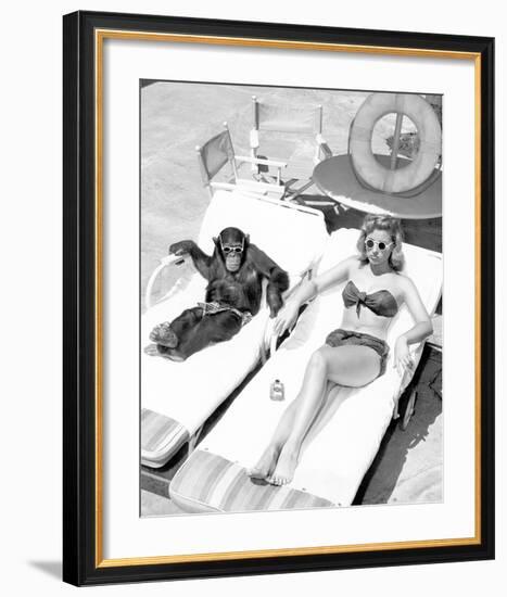 Chimpanzee & Woman Sunbathing-null-Framed Art Print