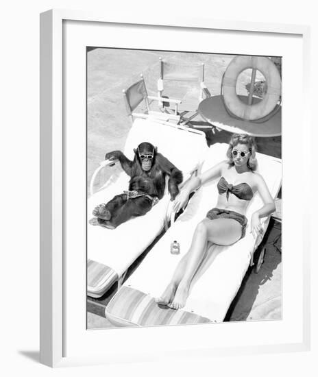 Chimpanzee & Woman Sunbathing-null-Framed Art Print