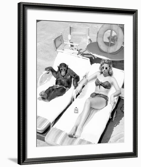 Chimpanzee & Woman Sunbathing-null-Framed Art Print