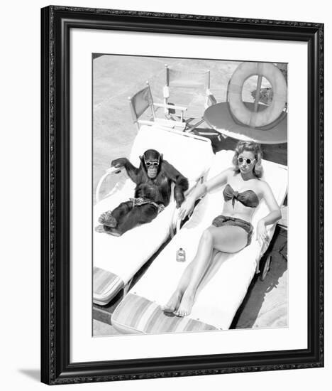 Chimpanzee & Woman Sunbathing-null-Framed Art Print