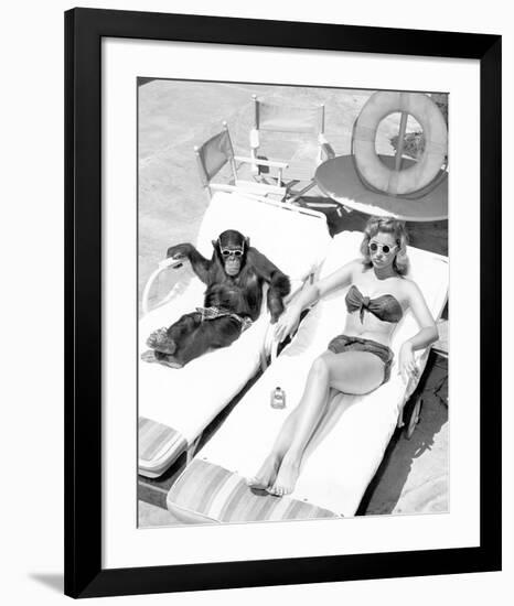 Chimpanzee & Woman Sunbathing-null-Framed Art Print