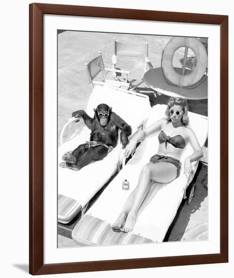 Chimpanzee & Woman Sunbathing-null-Framed Art Print