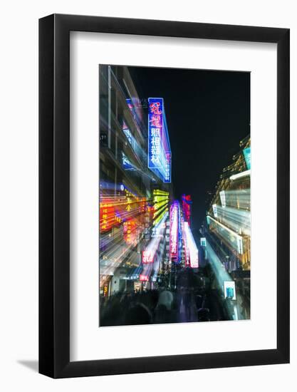China, Shanghai. Nanjing Road, neon sign blur.-Rob Tilley-Framed Photographic Print