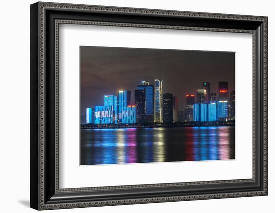 China, Zhejiang, Hangzhou. City skyline at twilight.-Rob Tilley-Framed Photographic Print