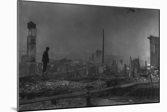 Chinese-American Man Against the Ruins of San Francisco's Chinatown. April 1906-null-Mounted Photo