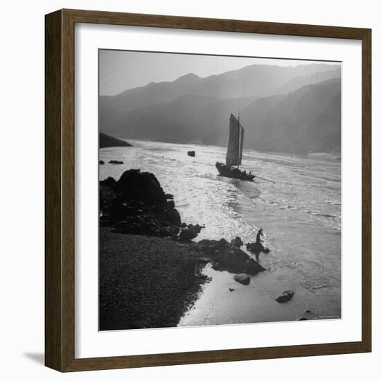 Chinese Junk Boat Sailing Past a Spear Fisherman on the Shore of the Yangtze River-Dmitri Kessel-Framed Photographic Print