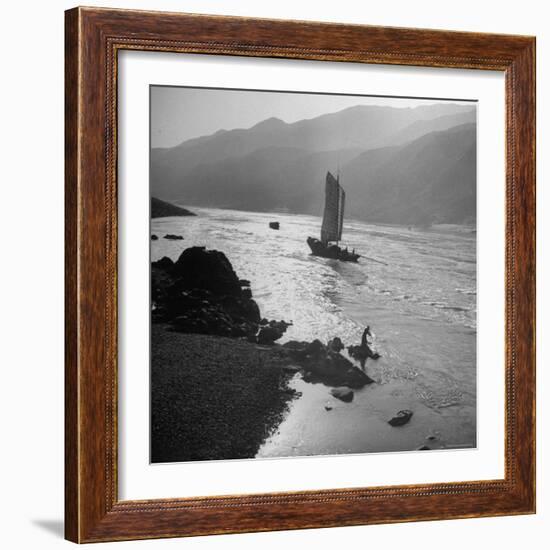 Chinese Junk Boat Sailing Past a Spear Fisherman on the Shore of the Yangtze River-Dmitri Kessel-Framed Photographic Print