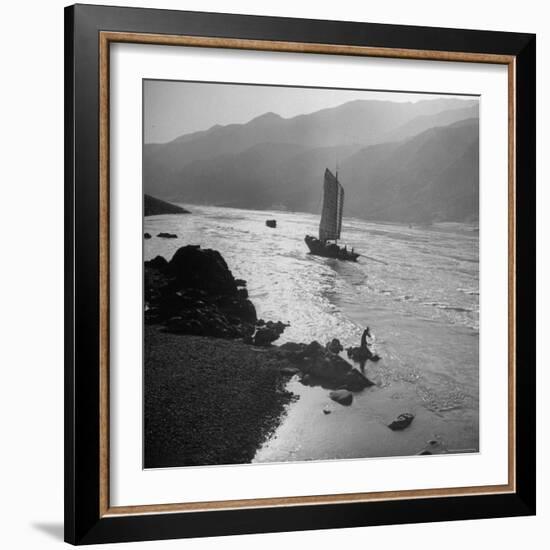 Chinese Junk Boat Sailing Past a Spear Fisherman on the Shore of the Yangtze River-Dmitri Kessel-Framed Photographic Print