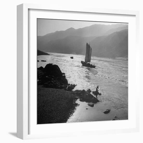 Chinese Junk Boat Sailing Past a Spear Fisherman on the Shore of the Yangtze River-Dmitri Kessel-Framed Photographic Print