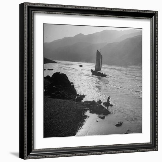 Chinese Junk Boat Sailing Past a Spear Fisherman on the Shore of the Yangtze River-Dmitri Kessel-Framed Photographic Print