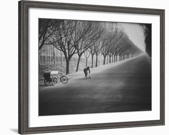 Chinese Street Cleaner Meticulously Sweeping This Tree Lined Road from the Peking Airport-John Dominis-Framed Photographic Print