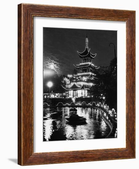 Chinese Styled Tower Viewed from Across an Ornamental Lake at Night in the Tivoli Amusement Park-Carl Mydans-Framed Photographic Print