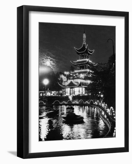 Chinese Styled Tower Viewed from Across an Ornamental Lake at Night in the Tivoli Amusement Park-Carl Mydans-Framed Photographic Print