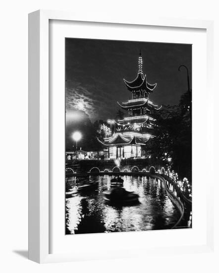 Chinese Styled Tower Viewed from Across an Ornamental Lake at Night in the Tivoli Amusement Park-Carl Mydans-Framed Photographic Print