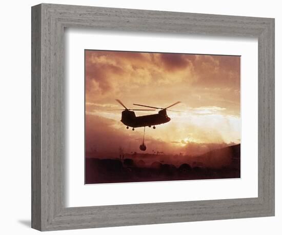 Chinook Helicopter Lifts Ammunition-null-Framed Photographic Print