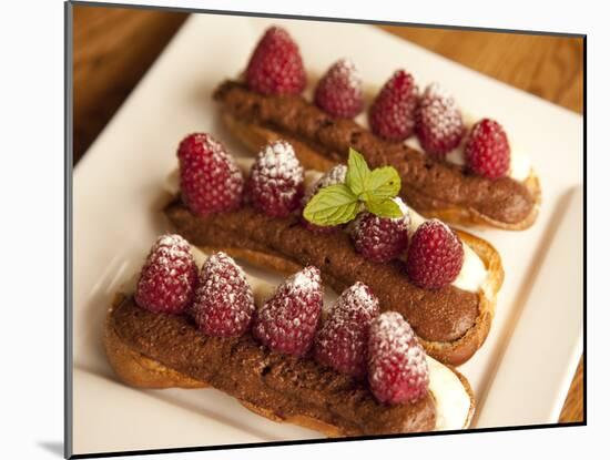 Chocolate Eclairs Topped with Raspberries, French Cafe, France, Europe-Frank Fell-Mounted Photographic Print
