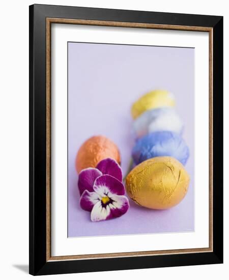 Chocolate Eggs in Foil, with Pansy-null-Framed Photographic Print