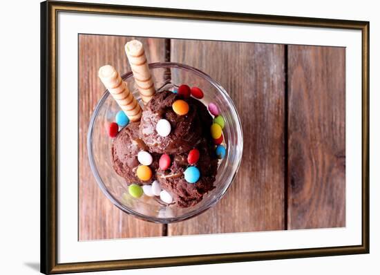 Chocolate Ice Cream with Multicolor Candies and Wafer Rolls in Glass Bowl, on Wooden Background-Yastremska-Framed Photographic Print