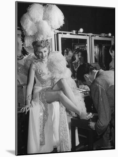 Chorus Girl Getting a Pedicure During Filming of the Movie "The Ziegfeld Follies"-John Florea-Mounted Photographic Print