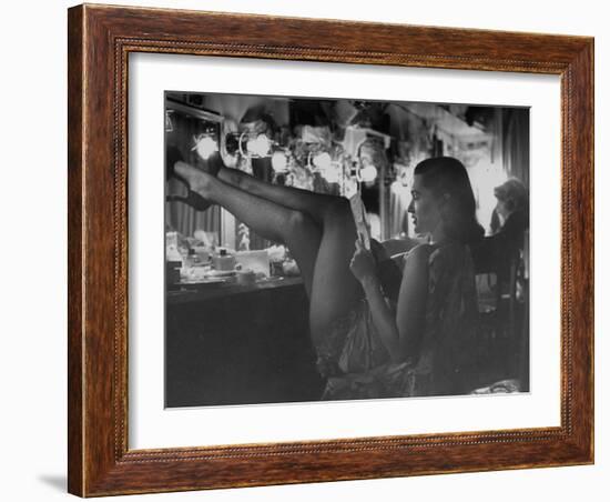 Chorus Girl-Singer Linda Lombard, Resting Her Legs after a Tough Night on Stage-George Silk-Framed Photographic Print