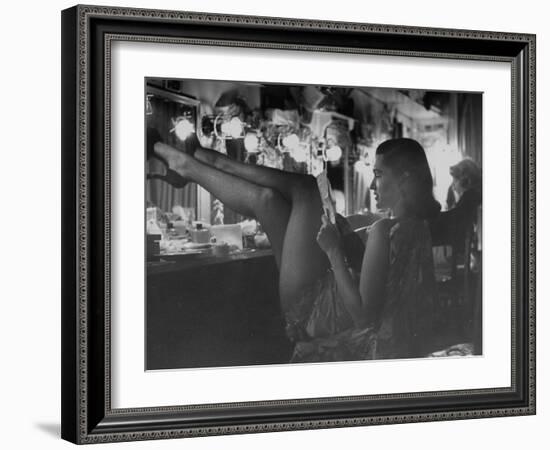 Chorus Girl-Singer Linda Lombard, Resting Her Legs after a Tough Night on Stage-George Silk-Framed Photographic Print