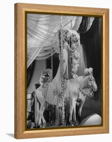 Chorus Girl Standing on Horse's Back During Filming of the Movie "The Ziegfeld Follies"-John Florea-Framed Premier Image Canvas