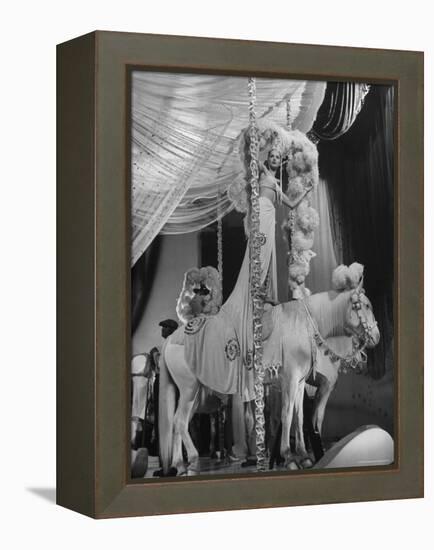 Chorus Girl Standing on Horse's Back During Filming of the Movie "The Ziegfeld Follies"-John Florea-Framed Premier Image Canvas