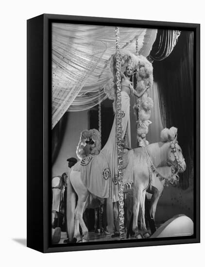 Chorus Girl Standing on Horse's Back During Filming of the Movie "The Ziegfeld Follies"-John Florea-Framed Premier Image Canvas