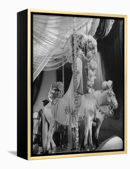 Chorus Girl Standing on Horse's Back During Filming of the Movie "The Ziegfeld Follies"-John Florea-Framed Premier Image Canvas