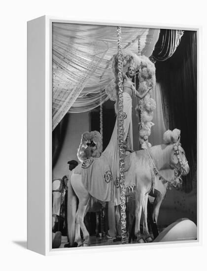 Chorus Girl Standing on Horse's Back During Filming of the Movie "The Ziegfeld Follies"-John Florea-Framed Premier Image Canvas
