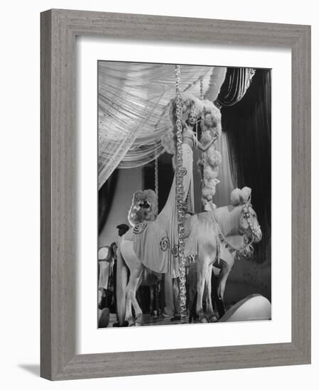 Chorus Girl Standing on Horse's Back During Filming of the Movie "The Ziegfeld Follies"-John Florea-Framed Photographic Print