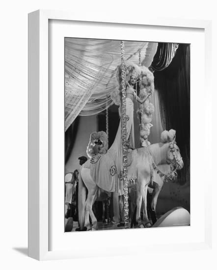 Chorus Girl Standing on Horse's Back During Filming of the Movie "The Ziegfeld Follies"-John Florea-Framed Photographic Print