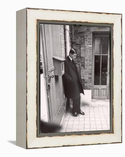 Christian Dior's Successor Yves Saint Laurent Standing Alone After Attending Dior's Funeral-Loomis Dean-Framed Premier Image Canvas