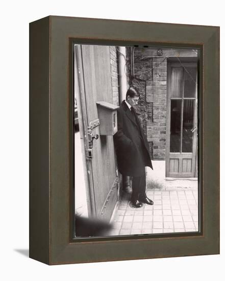 Christian Dior's Successor Yves Saint Laurent Standing Alone After Attending Dior's Funeral-Loomis Dean-Framed Premier Image Canvas